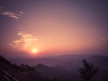 Scenic view of silhouette mountains against sky during sunset