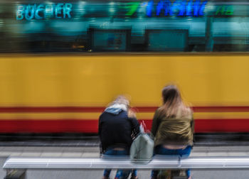 Blurred motion of train at railroad station platform