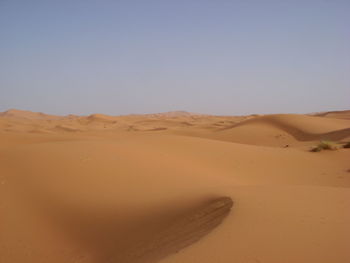 Scenic view of desert against clear sky