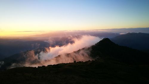 Scenic view of mountains against sky during sunset