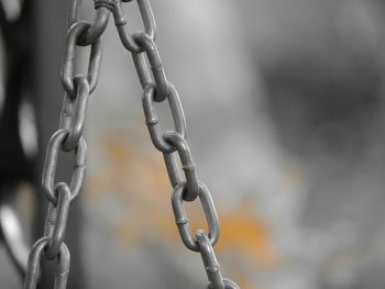 Close-up of chain hanging on metal