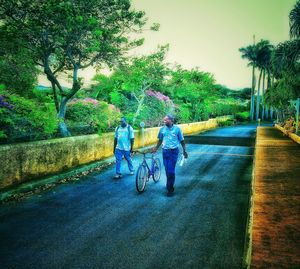 Woman walking on footpath