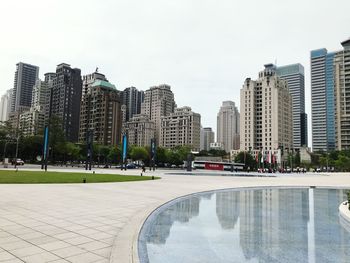 Modern buildings in city against sky