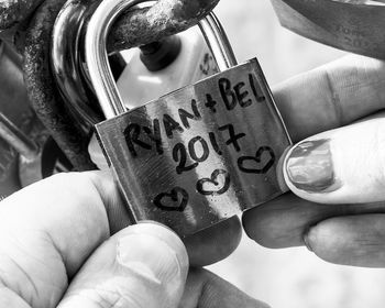 Close-up of hand holding text