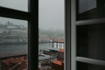 Buildings seen through glass window