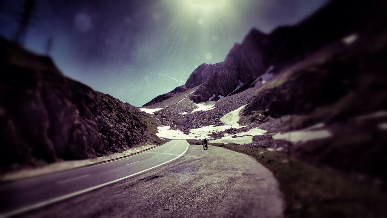 transportation, road, mountain, the way forward, snow, sky, country road, car, mode of transport, winter, landscape, tranquil scene, nature, beauty in nature, scenics, cold temperature, land vehicle, road marking, mountain range, tranquility