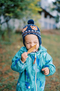 Portrait of cute girl playing in park