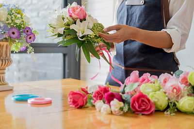 Close-up of pink roses on table