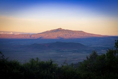 Scenic view of landscape against sky during sunset