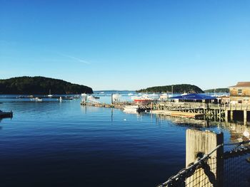 View of harbor against blue sky