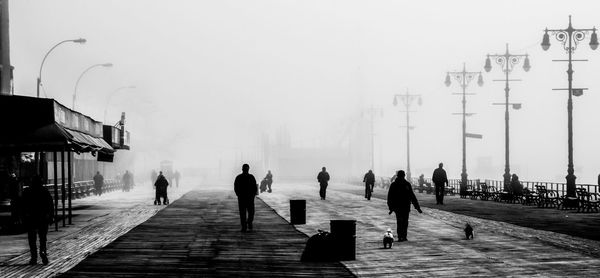 People on sea with city in background