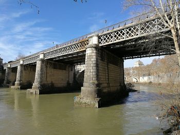 Bridge over river against sky