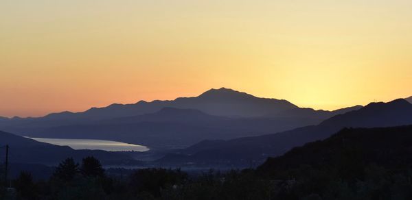 Scenic view of silhouette mountains against clear sky