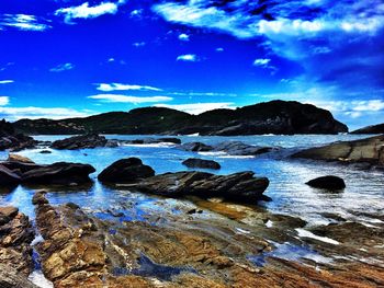 Scenic view of sea against cloudy sky