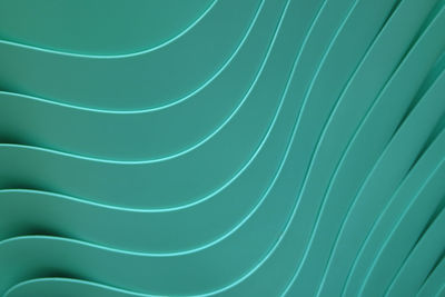 Beautiful curve lines of piled up teal color plastic bowls, for pattern and background