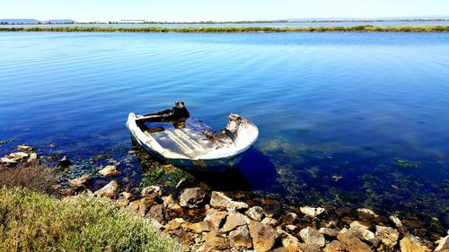 High angle view of abandoned boat moored on lake