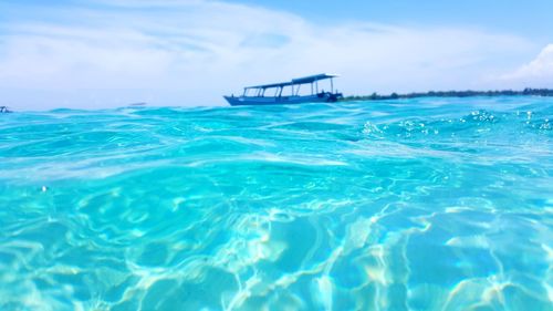 Swimming pool in sea against sky