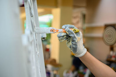 Cropped hand of painter painting