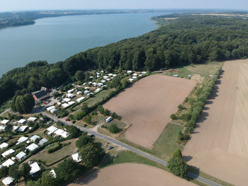 High angle view of landscape and sea against sky