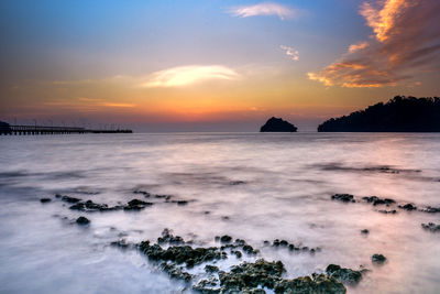 Scenic view of sea against sky during sunset