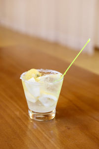 Close-up of cocktail on wooden table