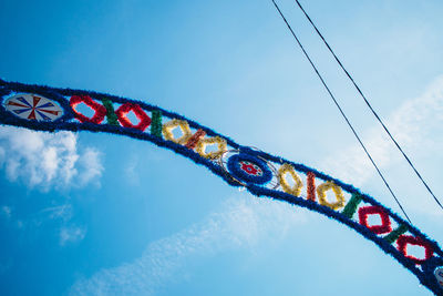 Low angle view of multi colored decoration against sky