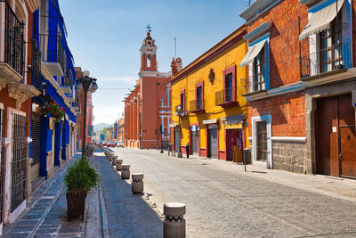 Road amidst houses in town