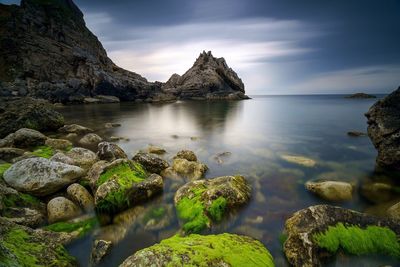 Scenic view of rocks in mountains against sky