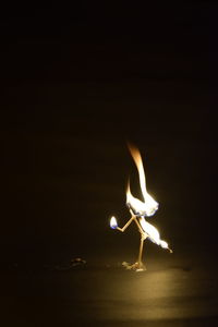 Close-up of fire against black background