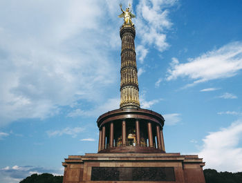 Low angle view of statue against cloudy sky