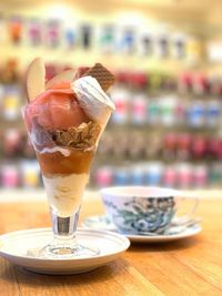 Close-up of ice cream in glass on table