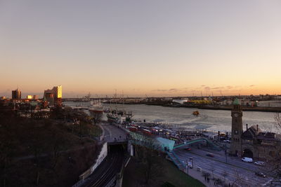 High angle view of bridge over river against sky during sunset