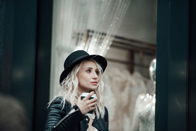 Portrait of young woman looking at camera