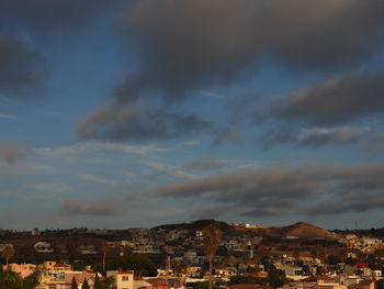 Houses in town against sky