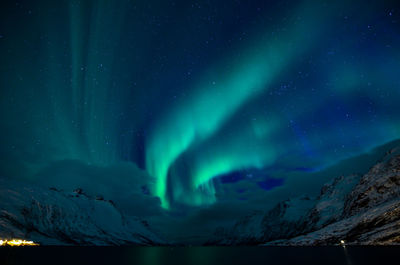 Scenic view of landscape against sky at night