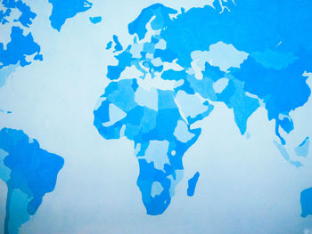 High angle view of blue paint on white background