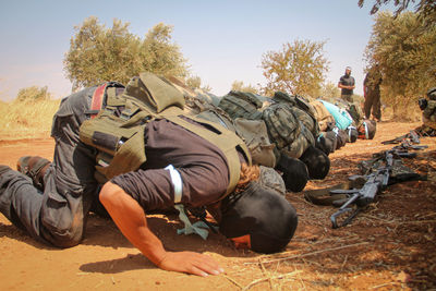 Syrian opposition fighters performing the prayer. the soldiers perform the prayer