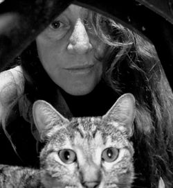 Portrait of young woman with cat