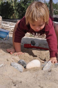 Boy playing on sand