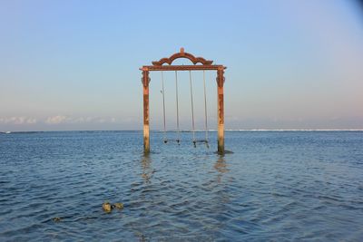 View of swimming in sea against sky