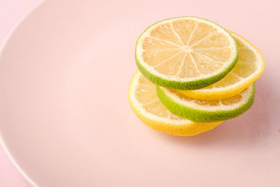 High angle view of lemon slice over white background