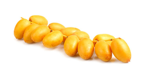 Close-up of oranges against white background