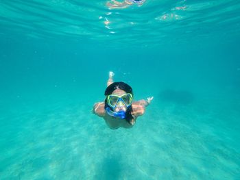 Portrait of woman swimming in sea