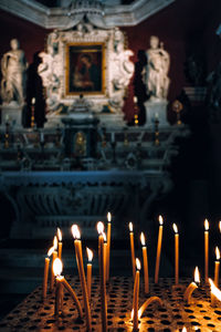 Lit candles in temple