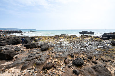 Volcanic rocks and reefs on the coast