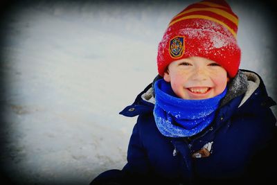 Portrait of a smiling man in snow