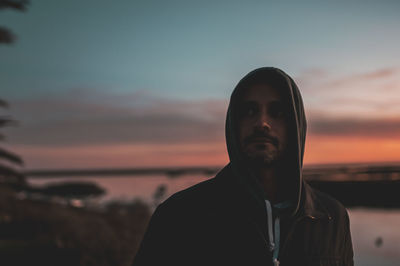 Man at beach during sunset