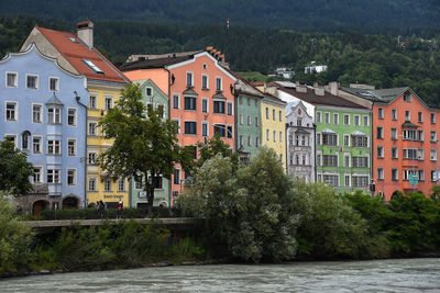 Colorful houses by inn river in innsbruck 