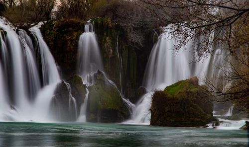 Scenic view of waterfall in forest