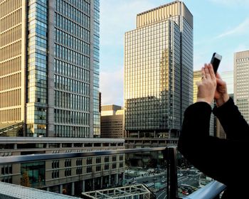 Low angle view of modern buildings against sky in city